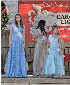ERICK MITCHELL | DISPATCH RECORD At left, Caroline Claude and Jessi Fields receive their sashes to designate them Snow Princess and Snow Queen, respectively.