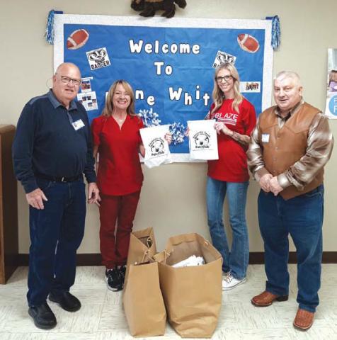 Saratoga Masonic Lodge #546 representatives Bob Caughron, at left, and Paul Plourde were at Kline Whitis Elementary School to donate “Fantastic Teeth Fan Club” dental kits for distribution to first-graders at the campus. Accepting the donation are Dana Tatum and Lori Fry. courtesy photo