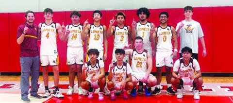 COURTESY PHOTO Hornets’ basketball team poses for a photo at their bi-district playoff game.