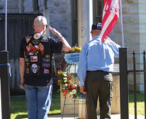 American Legion Post 277 members pay their respects in a wreath-laying ceremony at the Lampasas County Courthouse last year. File Photo