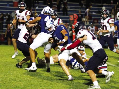 Reed Jerome runs past a Wimberley defender. The senior accounted for four touchdowns last Friday night. HUNTER KING | DISPATCH RECORD