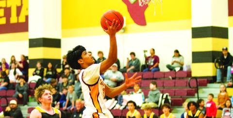 HUNTER KING | DISPATCH RECORD Pablo Carbajal goes up for a layup during the Hornets’ win over Santa Anna last Friday.