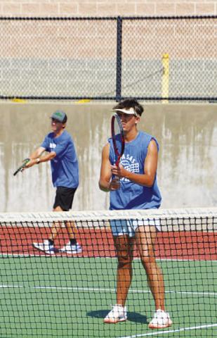 COURTESY PHOTO | KENNETH PEISER Tyler Ecker prepares to serve as Clyde Ashfield plays at the net.