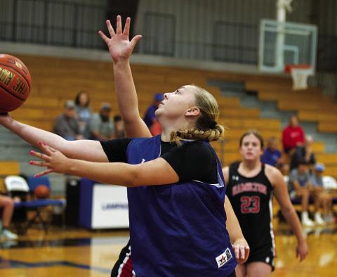 Kennedi Smart attempts a layup through traffic against Hamilton during the final summer league day. HUNTER KING | DISPATCH RECORD