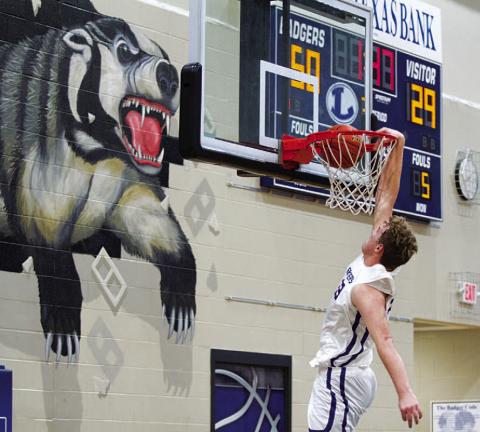 Beau Patterson throws down a dunk in the third quarter against Lago Vista. HUNTER KING | DISPATCH RECORD