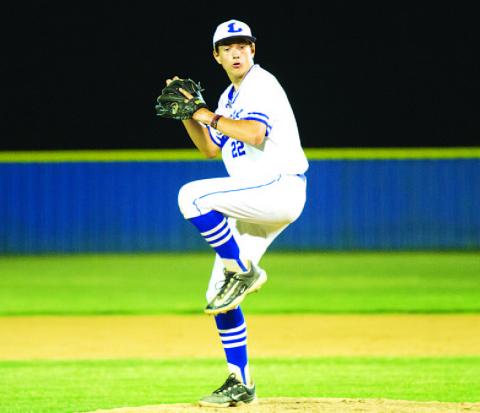 Calvin Phelps winds up to throw a pitch during the bases-loaded jam in the sixth inning. HUNTER KING | DISPATCH RECORD