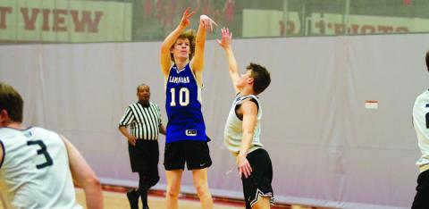 Peyton Sisson shoots a three-point shot over a defender during summer league action last week. HUNTER KING | DISPATCH RECORD
