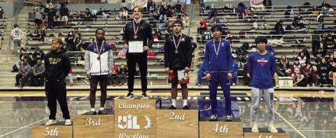 Kaiden Fernandez stands atop the podium at the regional wrestling tournament. COURTESY PHOTO