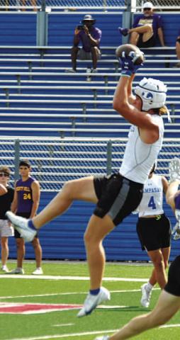 Reed Jerome goes up over the middle during 7-on-7 last year. HUNTER KING | DISPATCH RECORD