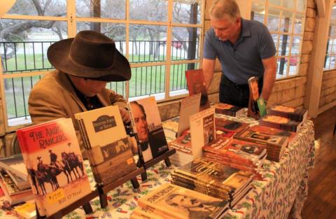 Historian Bill O’Neal, at left, is shown at a March 2020 Daughters of the Republic of Texas event at the Hostess House during which he signed books and spoke on the Texas Rangers in film. O’Neal will return to Lampasas March 7 for a presentation on World War II hero Audio Murphy. FILE PHOTO