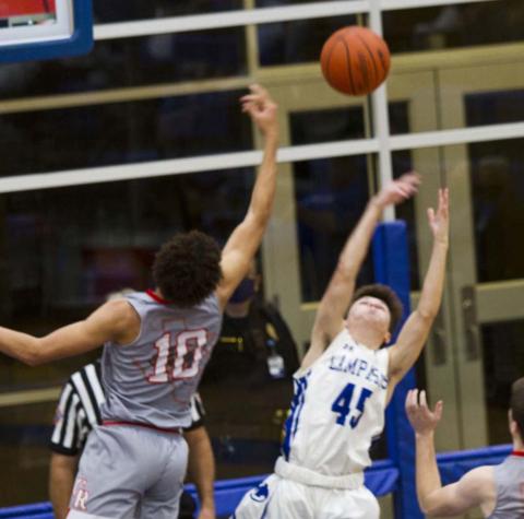 Austin Wilson stretches for a rebound