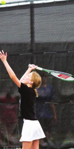 Presley Martin serves during the 2021 tennis camp led by Lampasas High School head coach Kenneth Peiser. FILE PHOTO