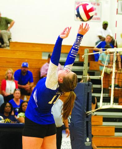 HUNTER KING | DISPATCH RECORD Ava Dowdy sets to Lilee Hamill in the match against Shoemaker.