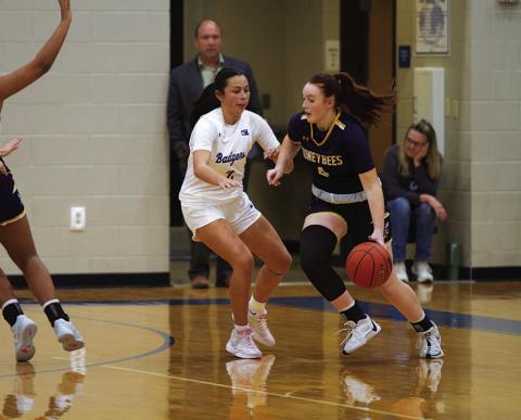 HUNTER KING | DISPATCH RECORD Johnnie Lewis defends the Stephenville ball handler during the Lady Badgers’ win over the Honeybees this week.