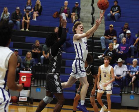 HUNTER KING | DISPATCH RECORD Peyton Sisson leaps to finsh a layup against Eastside Memorial out of Austin.