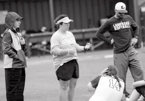 Macey Siegert, far left, is shown with head softball coach Jessica Harborth, assistant coach Logan Simmons, and players after a season-ending loss to Burkburnett. JEFF LOWE | DISPATCH RECORD