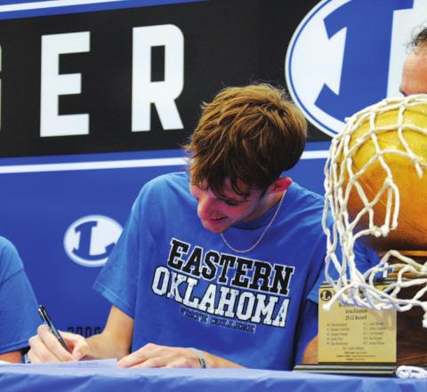 Kaeden Crawford signs his letter of intent to play basketball at the next level. HUNTER KING | DISPATCH RECORD