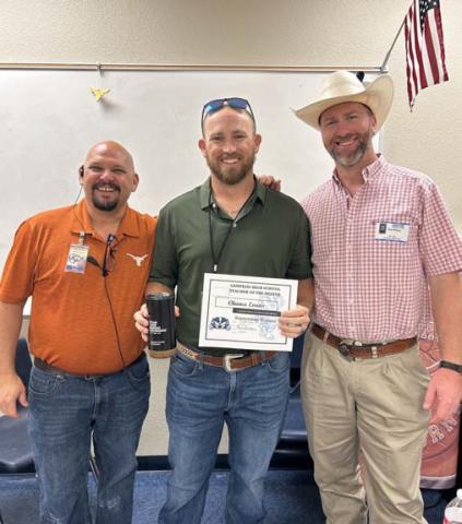 Chance Evans (center), a Lampasas High School head varsity baseball coach and career and technical education teacher, was named the campus’ September Teacher of the Month. Assistant Principal Ryan Race (left) credited Evans for his strong relationship with students. Texas Farm Bureau Insurance’s Clay Phillips also was on hand to recognize Davis. COURTESY PHOTO
