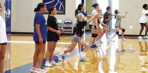 HUNTER KING | DISPATCH RECORD Middle school and incoming freshman Lady Badgers work on passing during volleyball camp last Wednesday morning.