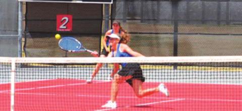 Abby Valdez runs to hit a shot near the net during her match with partner Kailr Clements at regionals. COURTESY PHOTO