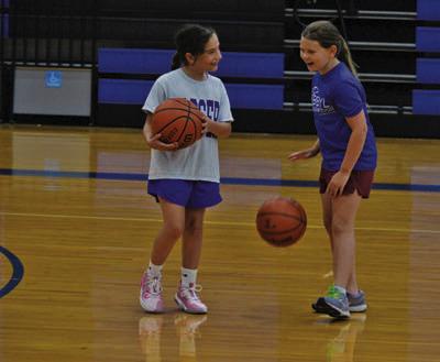 Campers share a laugh before Wednesday’s camp activities at Lampasas High School get started. ERICK MITCHELL | DISPATCH RECORD