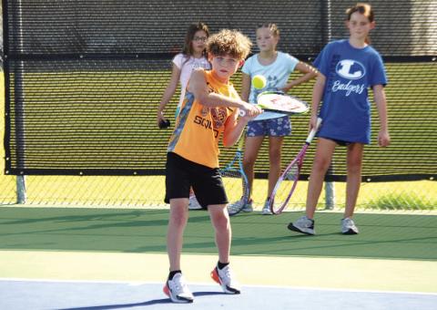 FILE PHOTO Kurt Hannabass works on a forehand shot during last summer’s tennis camp in July.