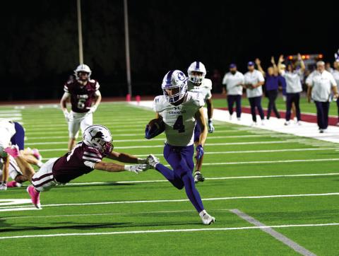 Shawn Roberts evades the Brownwood defender for the first touchdown of the game. HUNTER KING | DISPATCH RECORD