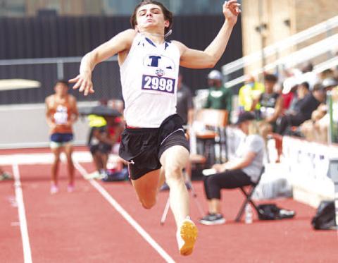 HUNTER KING | DISPATCH RECORD Asa White flies through the air during a jump attempt at the state track meet in Austin last Thursday.