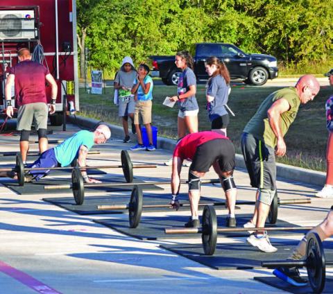 ALEXANDRIA RANDOLPH | DISPATCH RECORD Group workouts, even in organized settings like this east Houston competition, encourage rapport, healthy competitiveness and accountability.