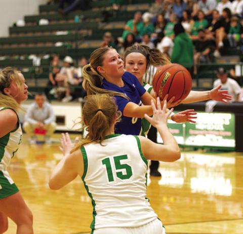 HUNTER KING | DISPATCH RECORD Addison Borchardt fights through contact to try and make a layup.