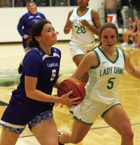 Brooke White drives to the basket against Burnet. HUNTER KING | DISPATCH RECORD