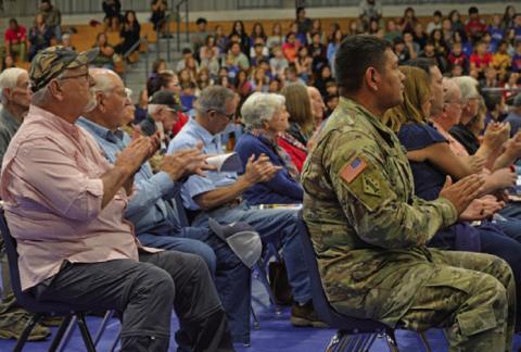 Veterans give a round of applause during Lampasas Middle School’s 21st annual Veterans Day program on Thursday. ERICK MITCHELL | DISPATCH RECORD