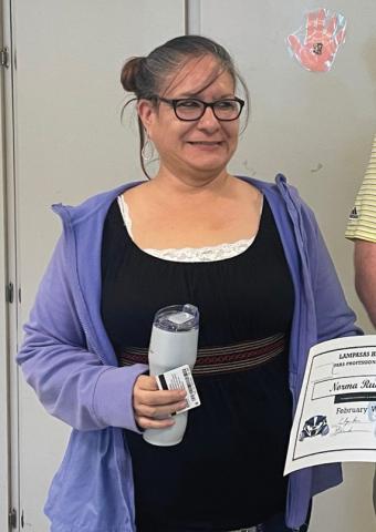 Lampasas High School special education staff member Norma Rude was honored as an educator of the month, shown here with tokens of appreciation from Clay Phillips of Farm Bureau Insurance. Rude “has worked wonders with some very challenging students but always shows them the love of a mother,” Assistant Principal Ryan Race said. Also recognized in February was Susan Knee, not pictured, who works as a substitute at the campus. COURTES Y PHOTO