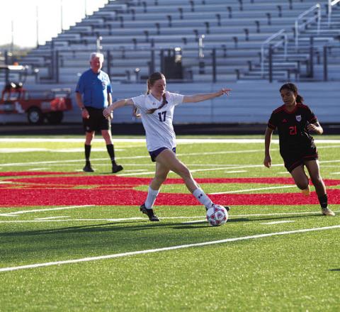 HUNTER KING | DISPATCH RECORD Kari Kepler intercepts a pass during the Lady Badgers’ playoff match.