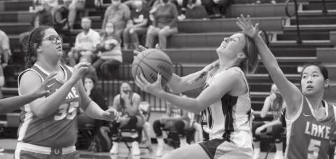 Cobie Chandler scores under the basket a day after recording her career-high 19 points against Elgin, a Conference 5A team. JEFF LOWE | DISPATCH RECORD