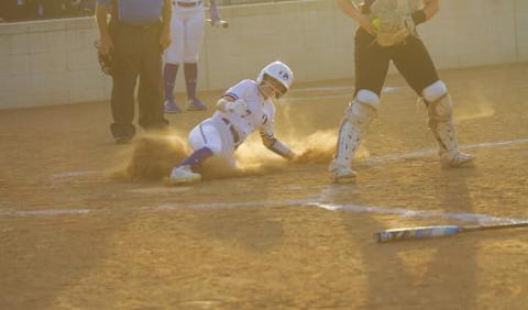Maylee Kates slides into home plate during the first inning of the Lady Badgers’ game against Jarrell on Tuesday. HUNTER KING | DISPATCH RECORD