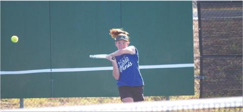 Allison Valdez swings through a backhand during the tennis team’s dominant win over Glen Rose. HUNTER KING | DISPATCH RECORD