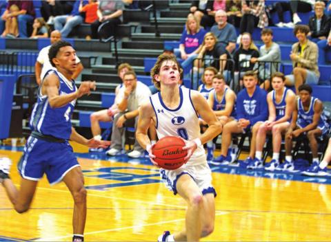 Nate Borchardt goes to the rim for a layup against Whitney in the same game he scored his 1,500th career point for the Badgers. HUNTER KING | DISPATCH RECORD