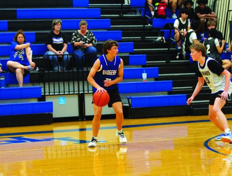 Ty Borchardt dribbles out on the perimeter during a spring league basketball game. HUNTER KING | DISPATCH RECORD