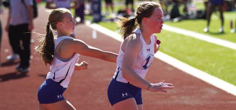 Aimee Weinheimer, left, and Lola Patterson ran in the 4x400-meter relay at the regional tournament. FILE PHOTO