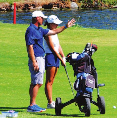 Head coach Justin Schulze talks about a shot with Shaylee Wolfe. HUNTER KING | DISPATCH RECORD