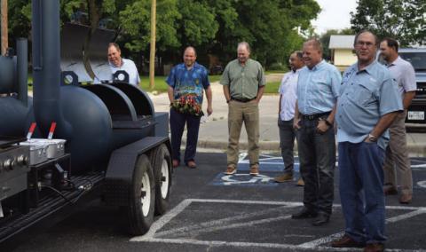 Creating Badger Builders members show the LISD Board of Trustees and other district officials the new smoker trailer the group donated to the high school’s culinary department earlier this year. ERICK MITCHELL | DISPATCH RECORD