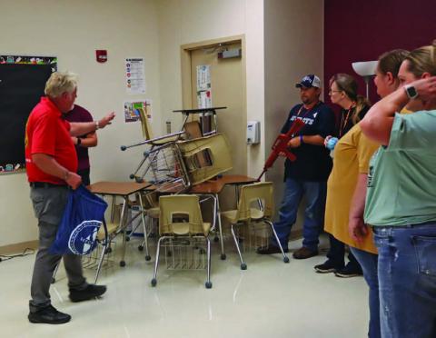 Johnny Price of Big Iron Handgun License Training in Waco directs Lometa teachers in a school safety training during inservice before the start of the new term. CHERI JAY-WIENECKE | DISPATCH RECORD