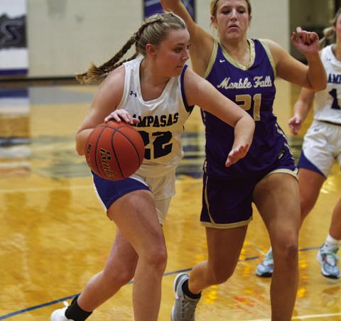 Kennedi Smart dribbles past a Lady Mustang defender in last Friday’s contest. HUNTER KING | DISPATCH RECORD