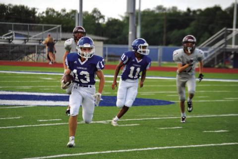 HUNTER KING | DISPATCH RECORD Tate Langford (13) and Jaden McElwain (11) look to continue the freshman team’s winning ways.