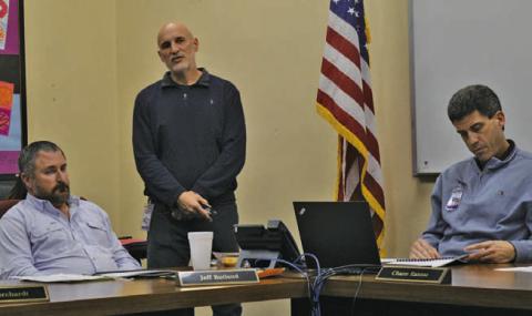 Assistant Superintendent Dana Holcomb, standing, provides Lampasas ISD Board of Trustees members with the annual Texas Academic Performance Review from the Texas Education Agency. Also pictured are trustee Jeff Rutland, at left, and Superintendent Dr. Chane Rascoe. ERICK MITCHELL | DISPATCH RECORD