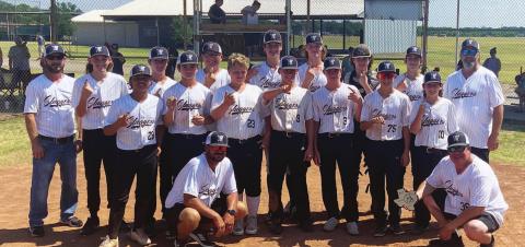The Sluggers pose for a photo after winning district, and they will be on to the state tournament next week. COURTESY PHOTO