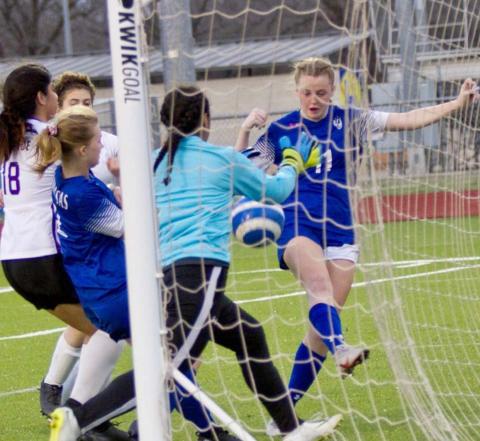 Becca Nobles (11) scores the Lady Badgers’ third goal in their season finale, a 3-0 win over Florence. JEFF LOWE | DISPATCH RECORD