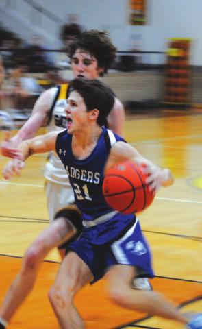 Austin Wilson drives to the basket against a Gatesville defender in last Friday’s contest. HUNTER KING | DISPATCH RECORD