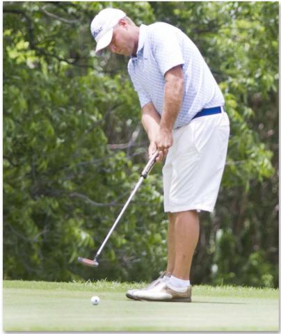 Justin Schulze putts on Hole No. 11 at Hancock Park Golf Course on Saturday afternoon. JEFF LOWE | DISPATCH RECORD